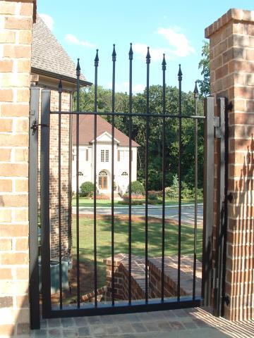 Wrought iron gate with arched pickets | walkthrough aka man-gate