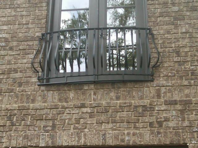 wrought iron safety railing with belly balusters for faux balcony