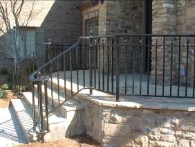 Ornamental Wrought Iron Handrails with alternating finial pattern and lateral spiral terminal