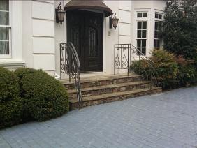 Ornamental Wrought Iron Rails with bent handrails, scroll work and split rail