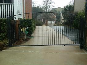 Ornamental Wrought Iron Automated Gates with arched split rail